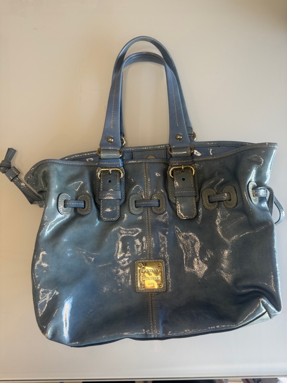 Dooney & Bourke Shiny Slate Blue Patent Tote with Buckle Accents